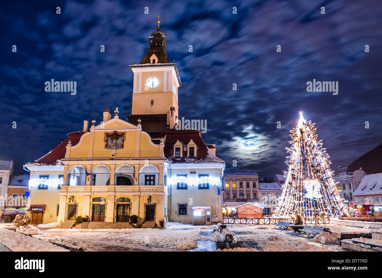 Brasov, Romania. Council Square and Xmas Tree. Historical medieval old city center square of Brasov in Christmas days. Stock Photo