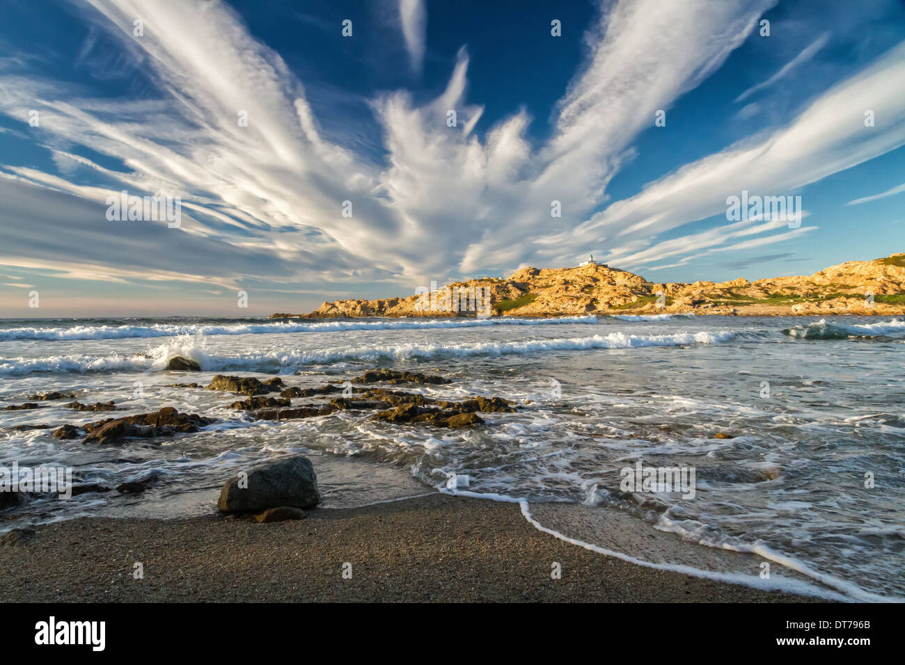 The lighthouse on the red rock in the town of Ile Rousse in the Balagne ...