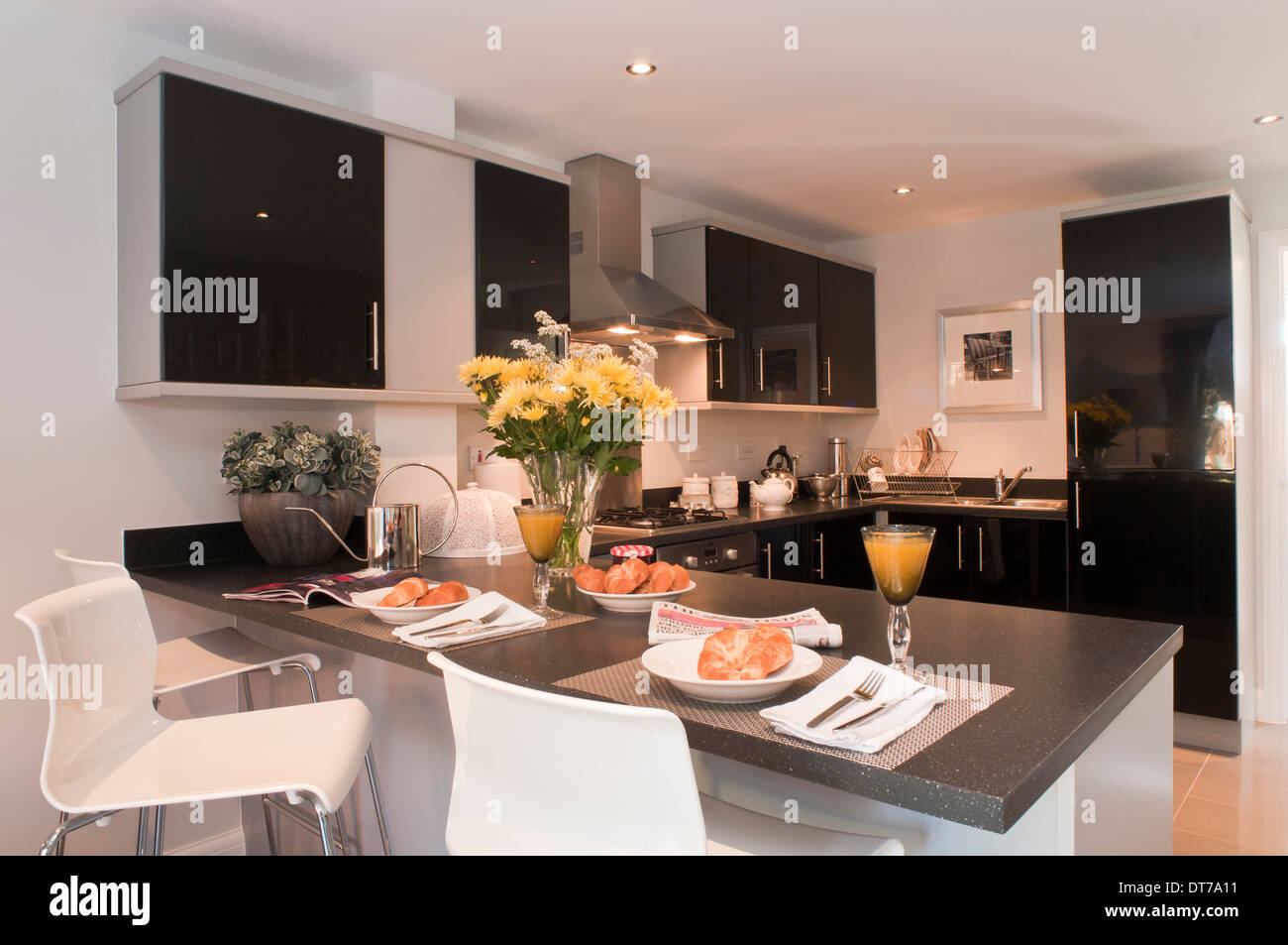 Modern black fitted kitchen Stock Photo