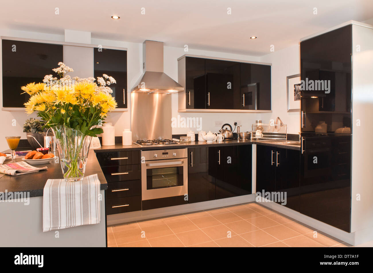 Modern black fitted kitchen Stock Photo