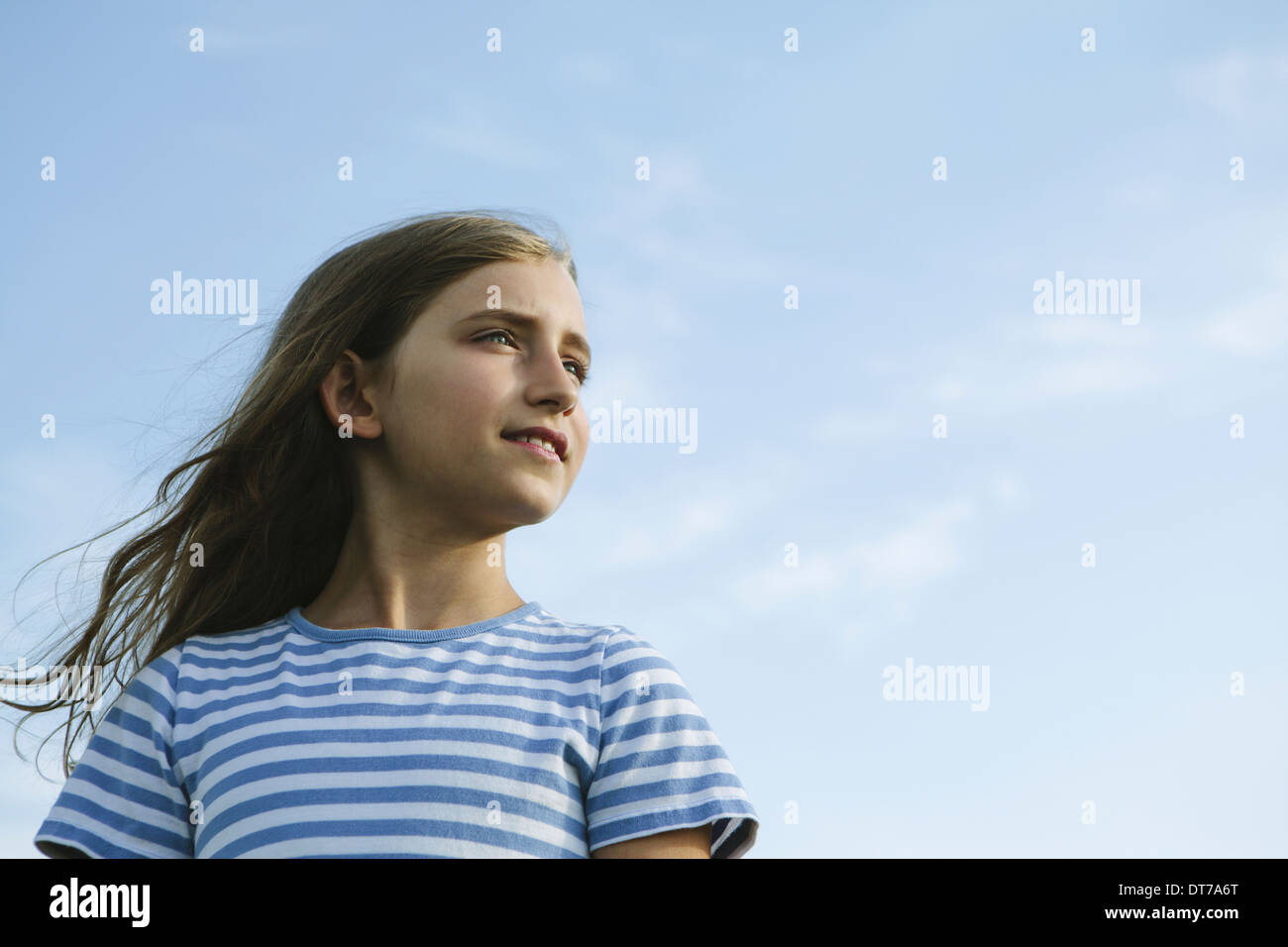 Portrait of a confident and happy nine year old girl outdoors King ...