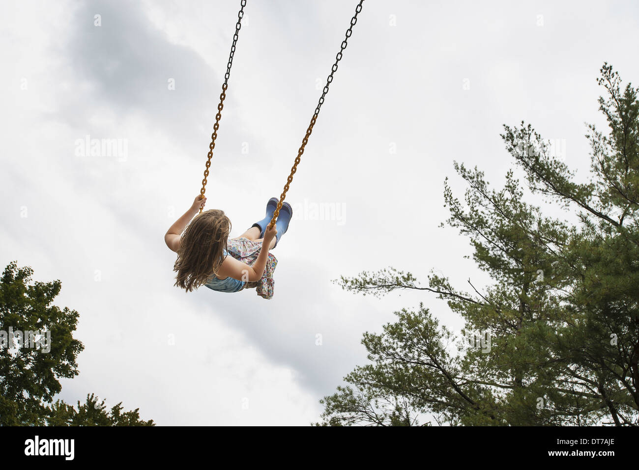 A girl on a rope swing high in the air Woodstock New York USA USA Stock
