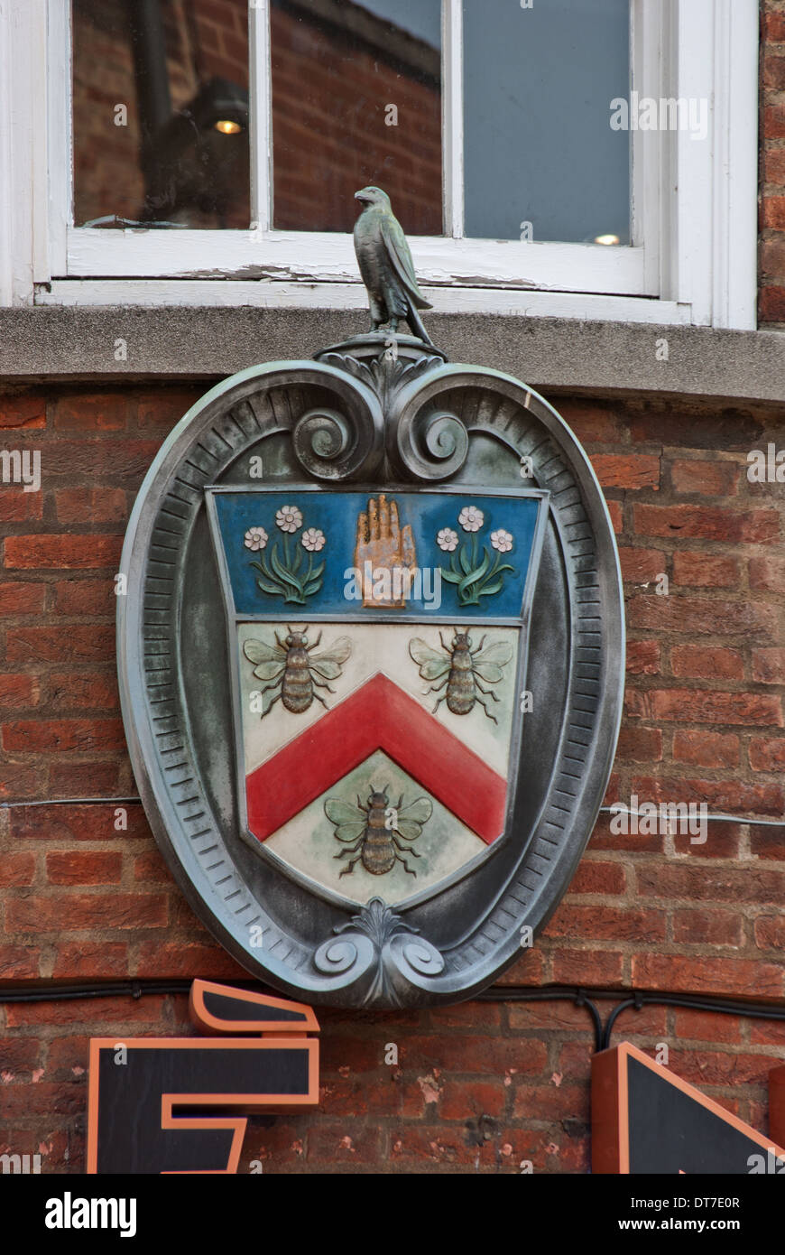 Coat of arms of the Burnley Building Society above Cafe Nero in York Stock Photo