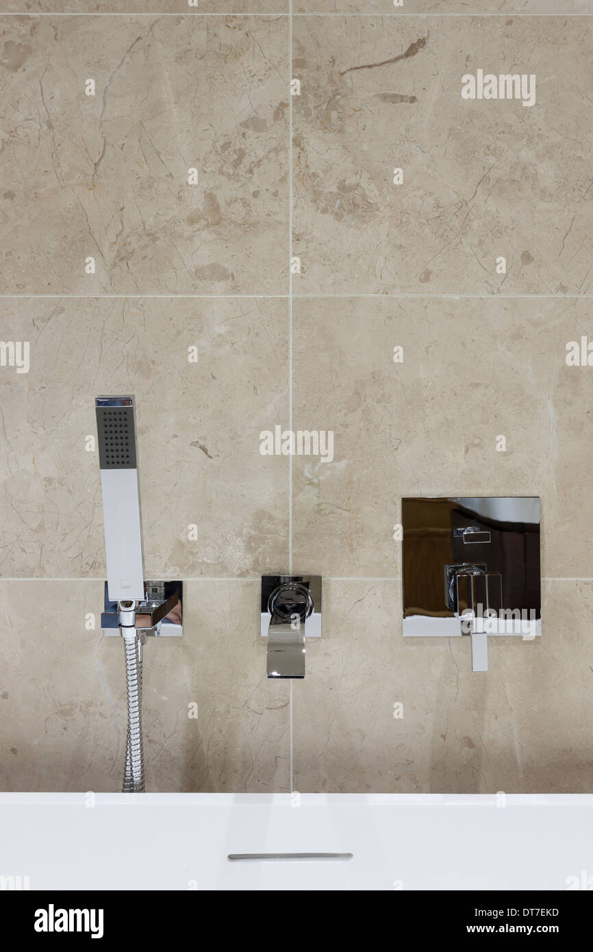 Luxury bathroom with Mandarin Stone tiling Stock Photo Alamy