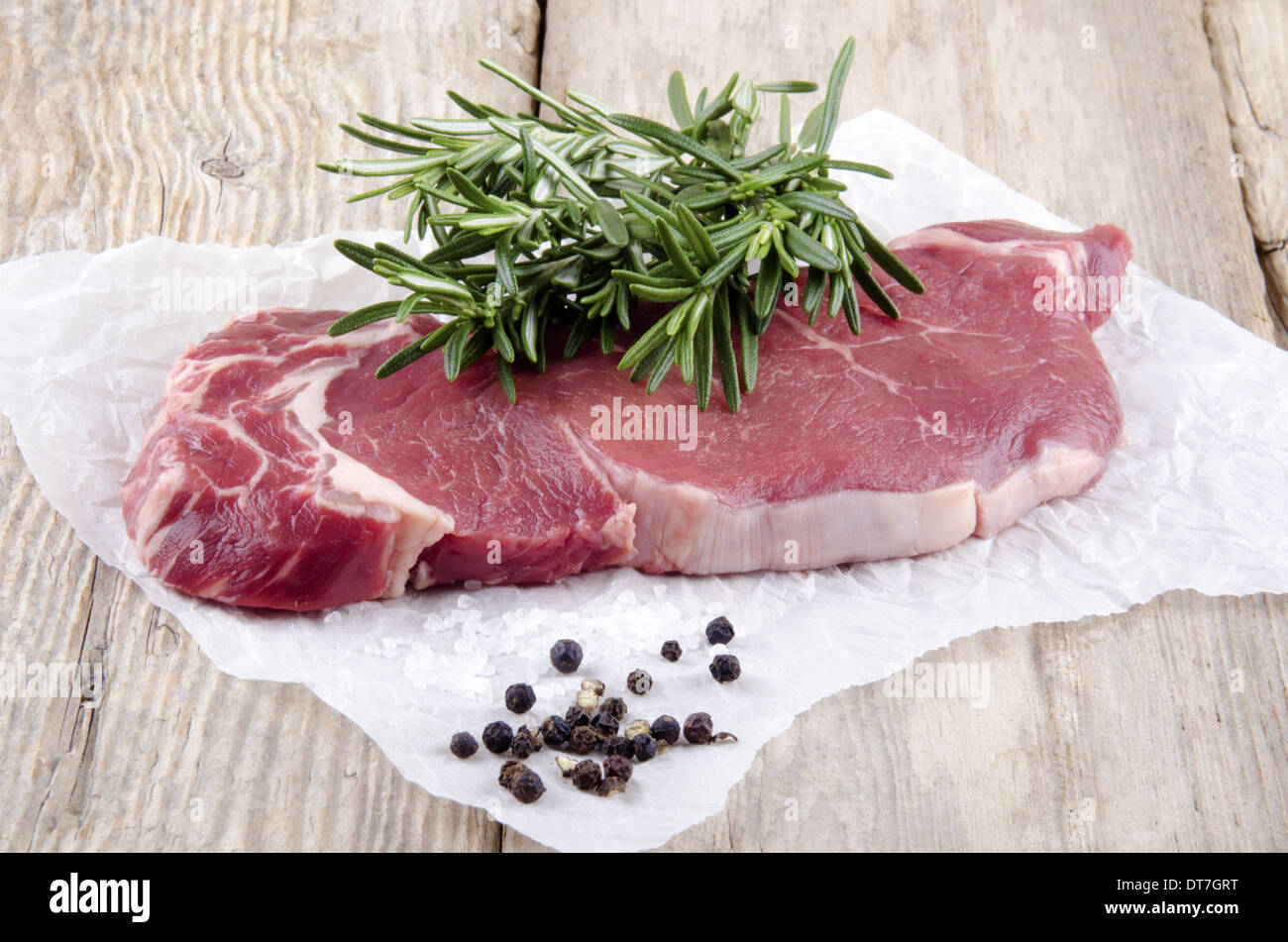 beef sirloin steak with rosemary on kitchen paper Stock Photo Alamy