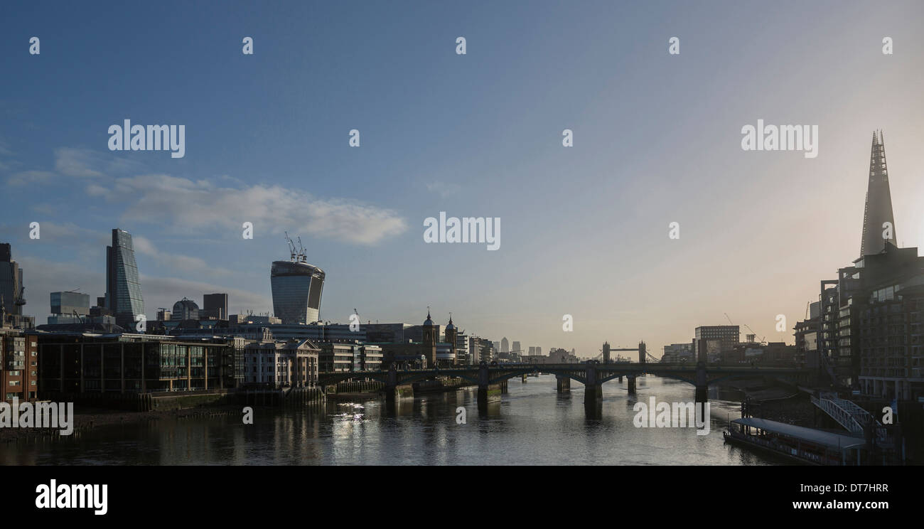 The London skyline with The Shard, Blackfriars Bridge, Tower Bridge and in the distance Canary Wharf. Stock Photo