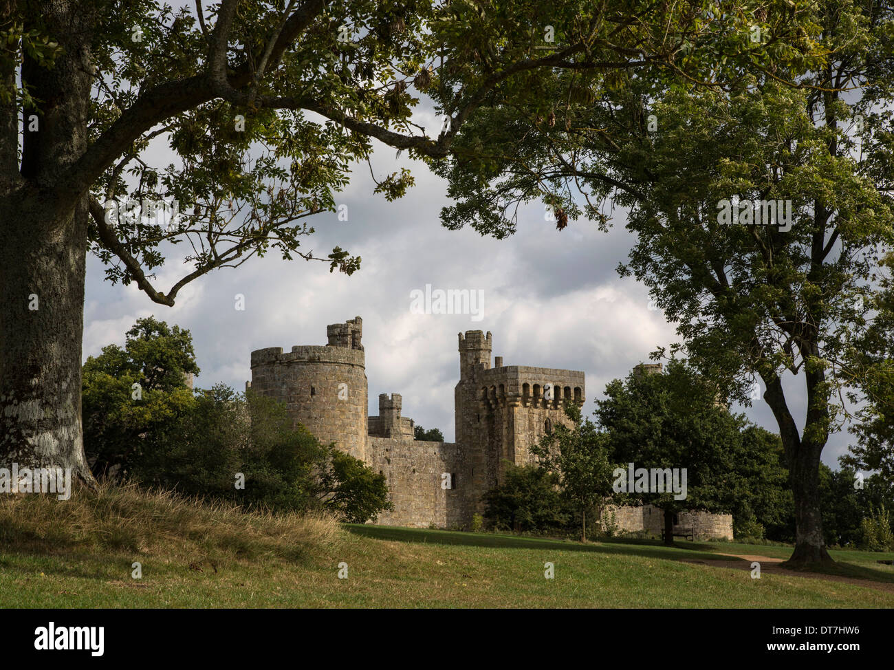 Bodium Castle framed by trees. Stock Photo