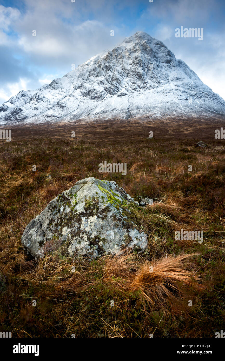 Peak of Stob Dearg reflected in the shape of a boulder on Buachaille Etive Mor, Glencoe, Highlands, Scotland. UK Stock Photo