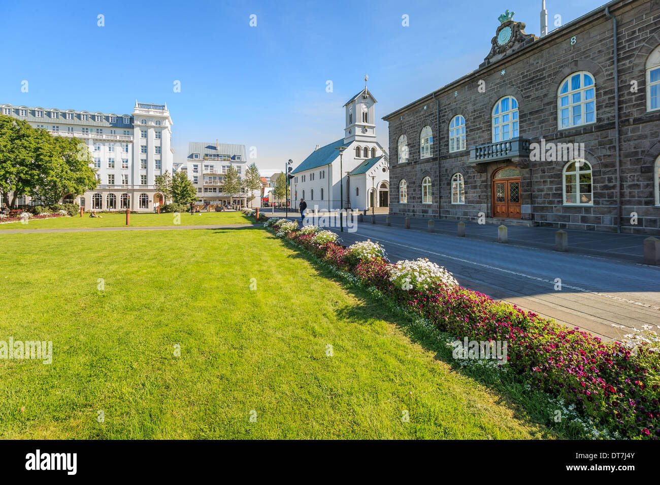 The Parliament or Althing, Reykjavik, Iceland. Domkirkjan Church on the left. Stock Photo