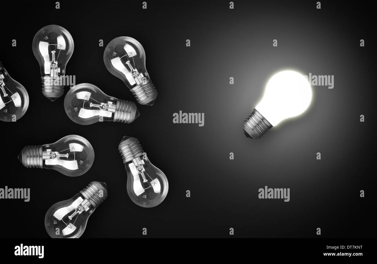 Idea concept with light bulbs, one of them is glowing Stock Photo Alamy