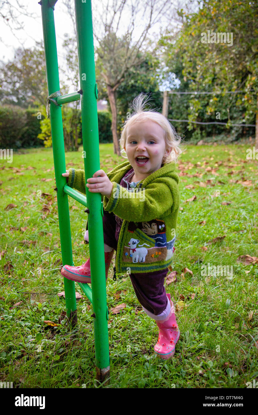 CHILD PLAYING OUTDOORS Stock Photo