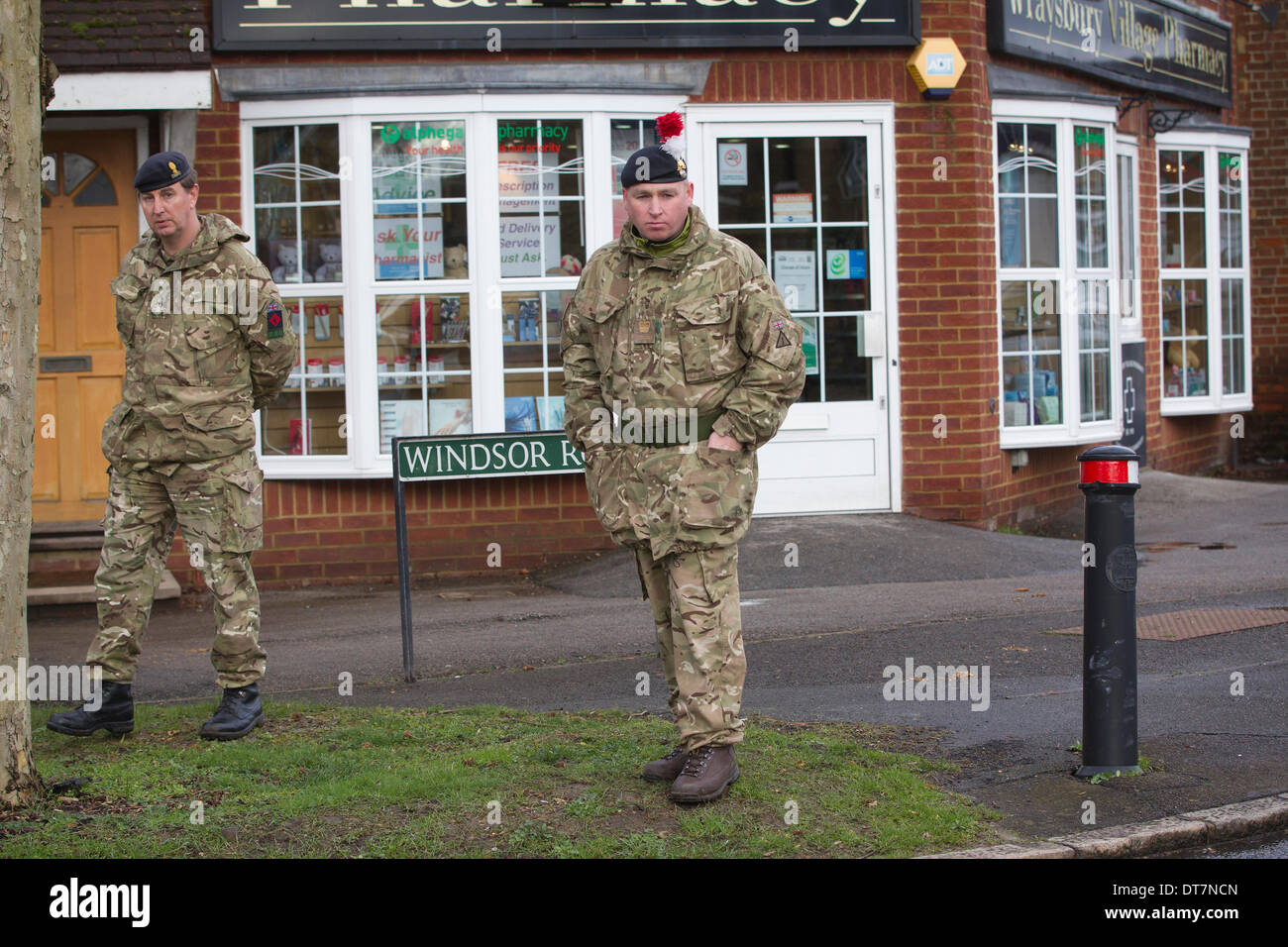 Datchet, Berkshire, UK. 11th Feb, 2014. Picture shows Royal Engineer & Fusilier Military on the high street in Datchet in the Thames Valley area West of London. Hundreds of families are having to leave their houses due to the rising water levels across the region. Credit:  Jeff Gilbert/Alamy Live News Stock Photo