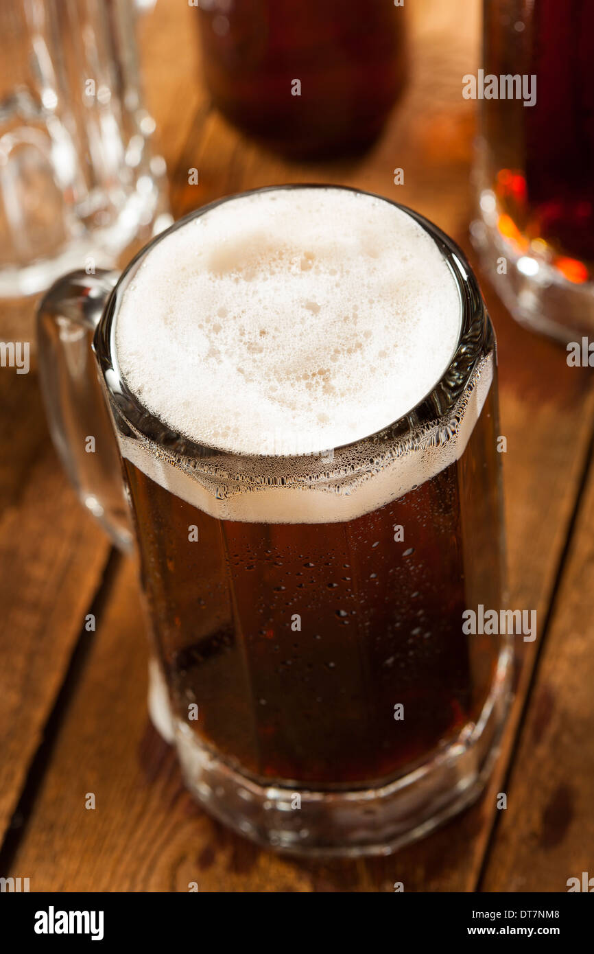 Cold Refreshing Root Beer with Foam in a Mug Stock Photo - Alamy