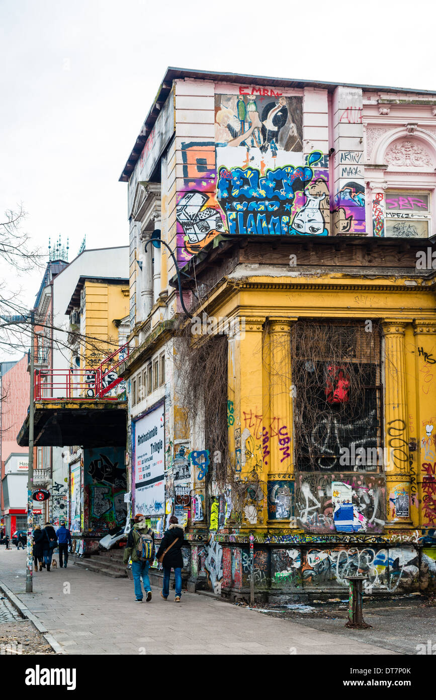 HAMBURG, GERMANY – FEBRUARY 8, 2014: People are passing the Rote Flora building, a former theatre that is occupied as autonomous Stock Photo