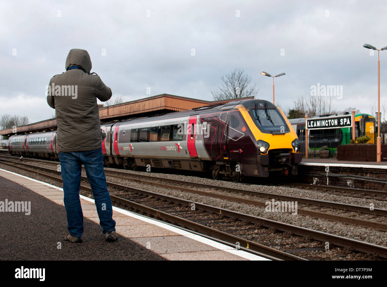 A rail enthusiast photographing a diesel train, Leamington Spa, UK Stock Photo Alamy