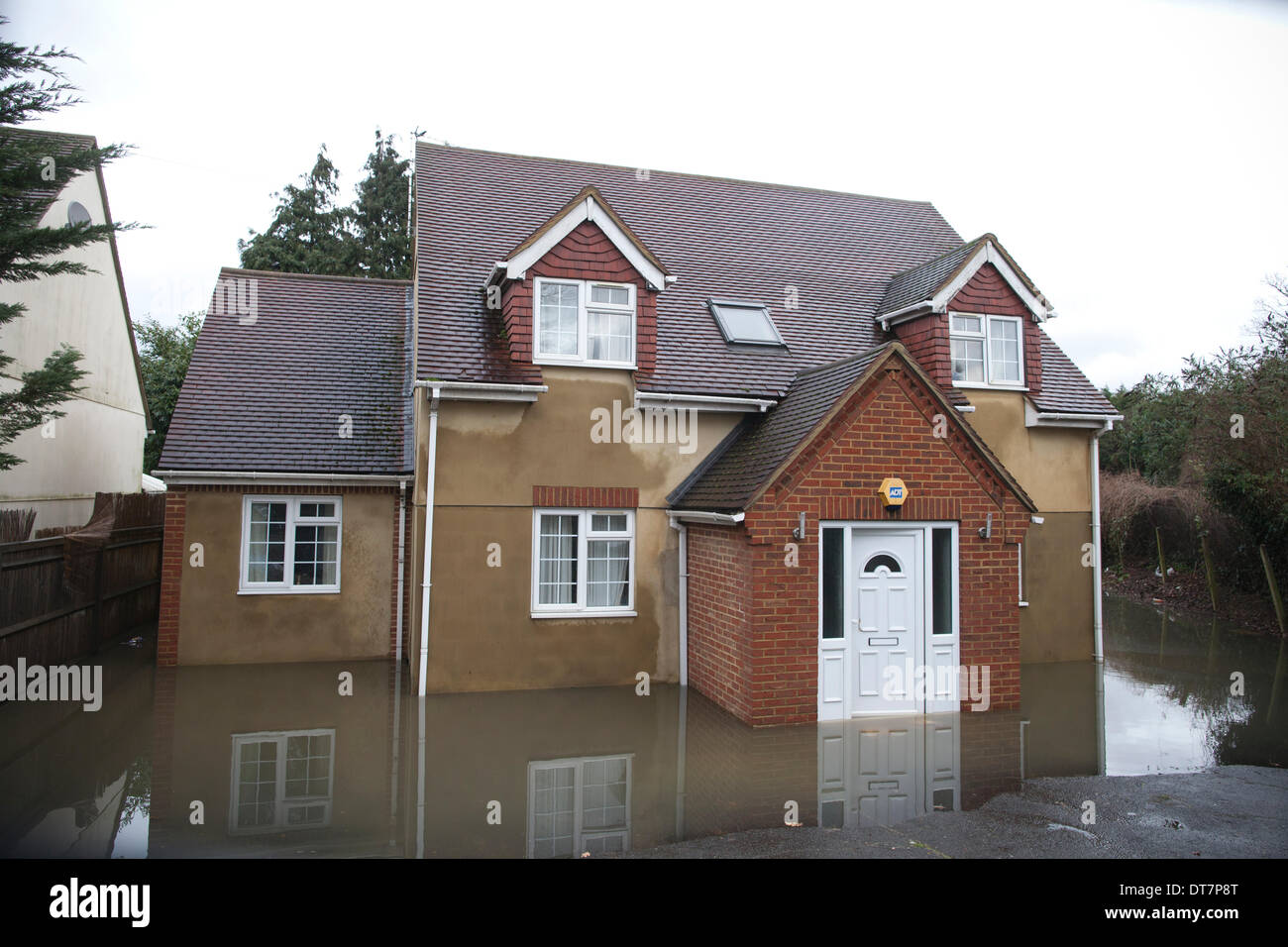 Pooley Green, UK. 11th Feb, 2014. Picture shows a newly built house in the Pooley Green area in the Thames Valley area West of London. Hundreds of families are having to leave their houses due to the rising water levels across the region. Credit:  Jeff Gilbert/Alamy Live News Stock Photo