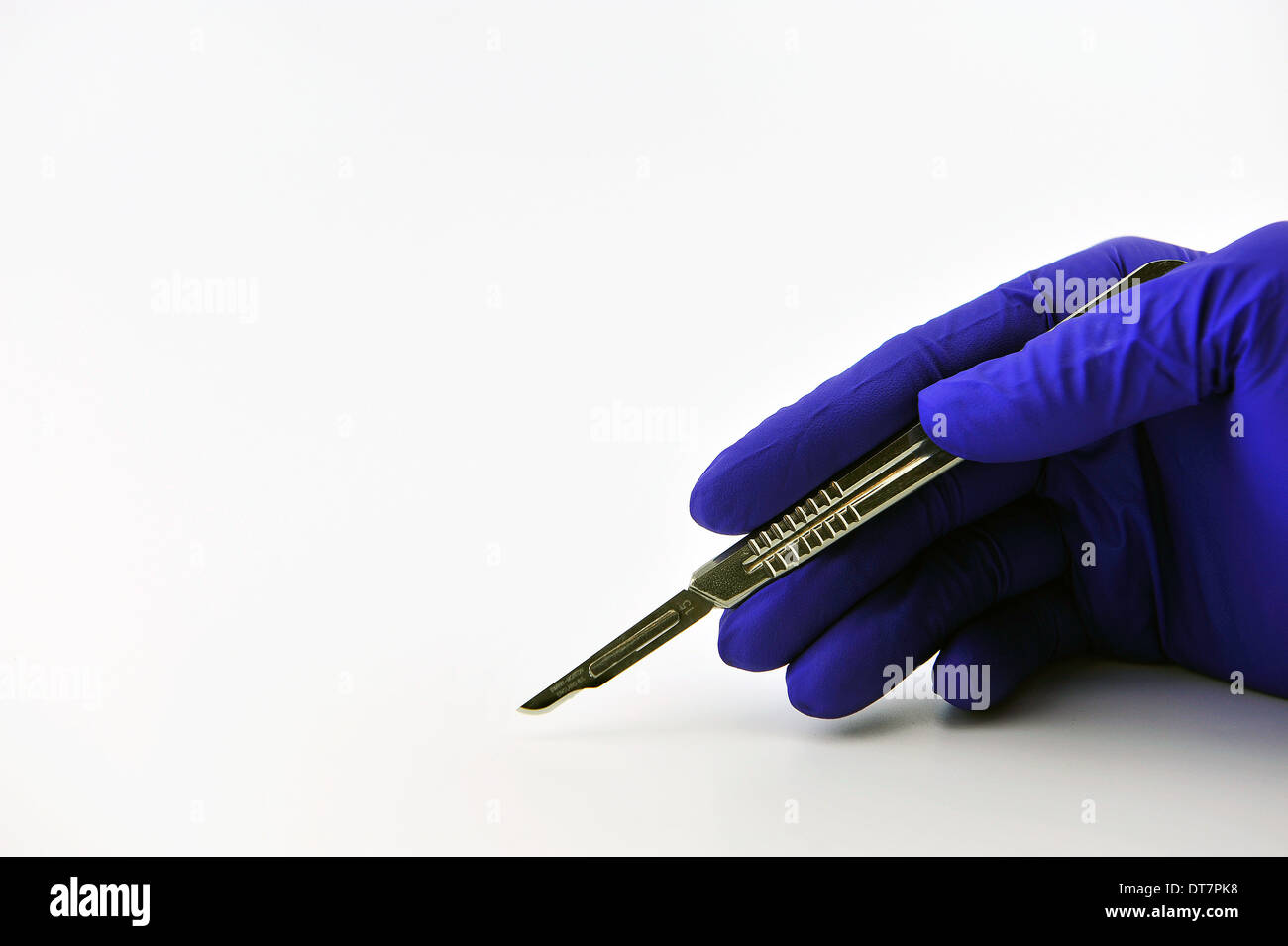 Surgical blades and glove Stock Photo