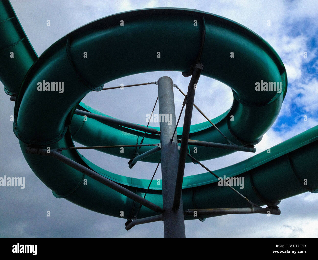 Outdoor structure of spiral water slide at swimming pool Stock Photo