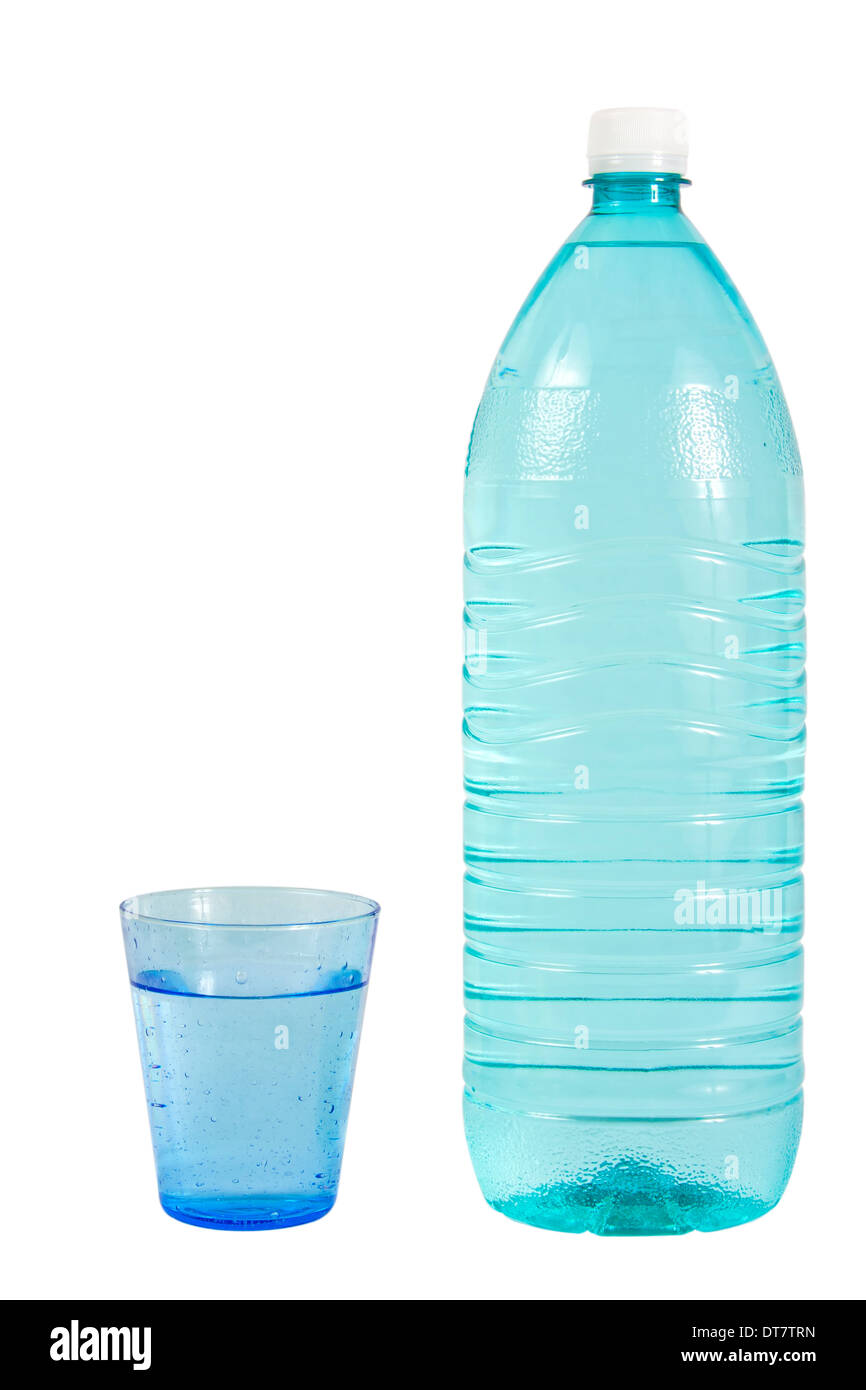 Glass filled with water and a green plastic bottle of water Stock Photo