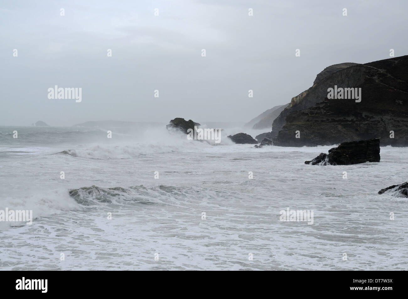 Cliffs on the cost of Cornwall being battered by rough seas in the UK storm Stock Photo