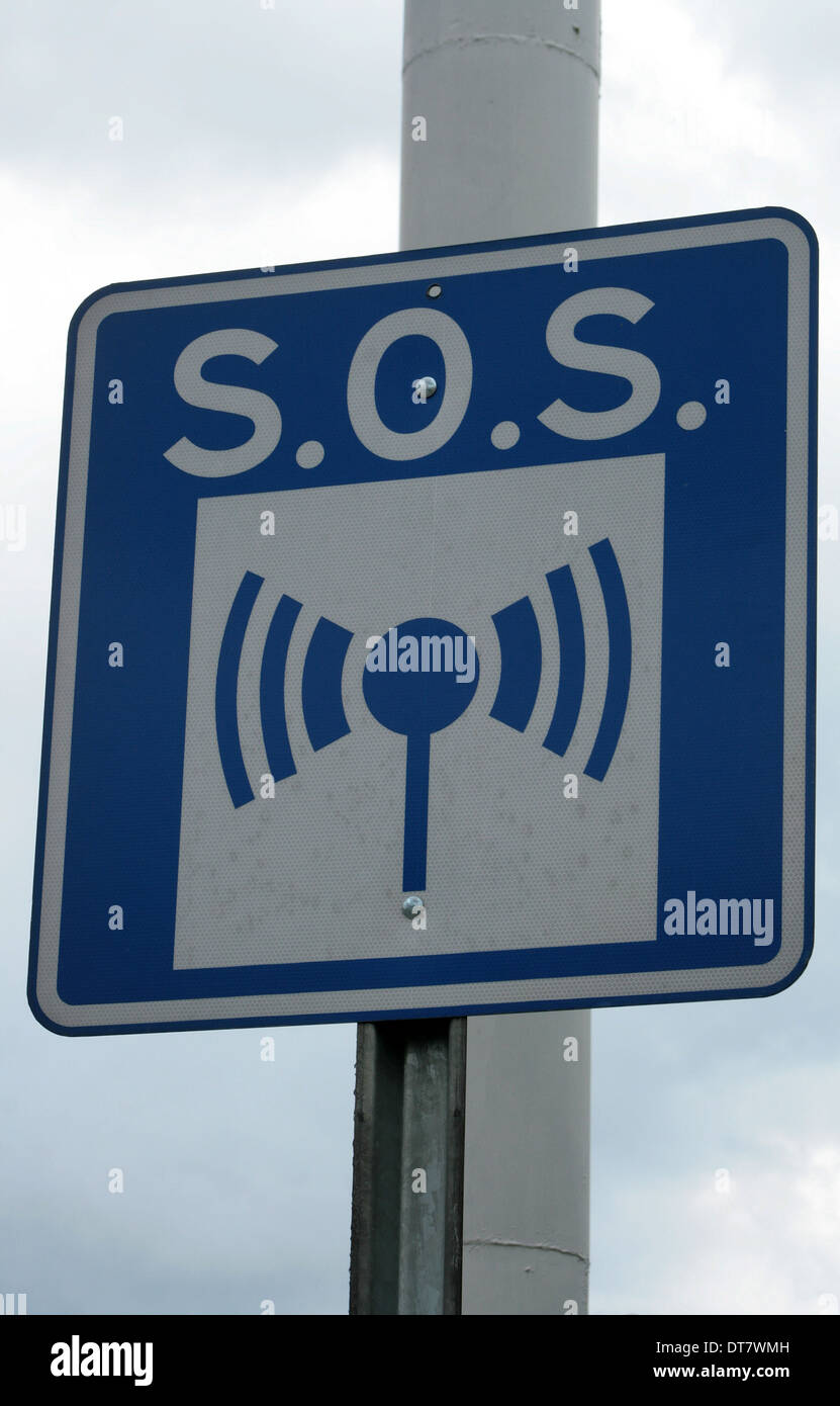 An SOS road sign on the side of a street in Cotacachi, Ecuador Stock Photo