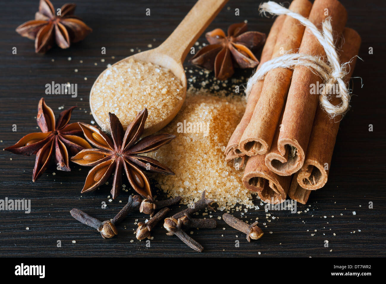 Various spices - anise, cinnamon, clove and cane sugar Stock Photo