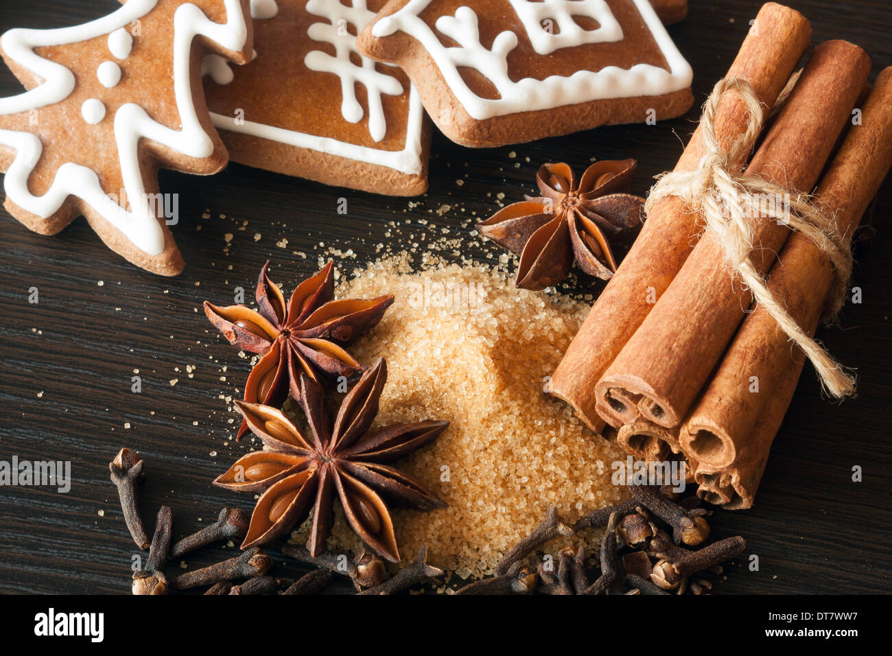 Cookies and various spices - anise, cinnamon, clove and cane sugar Stock Photo