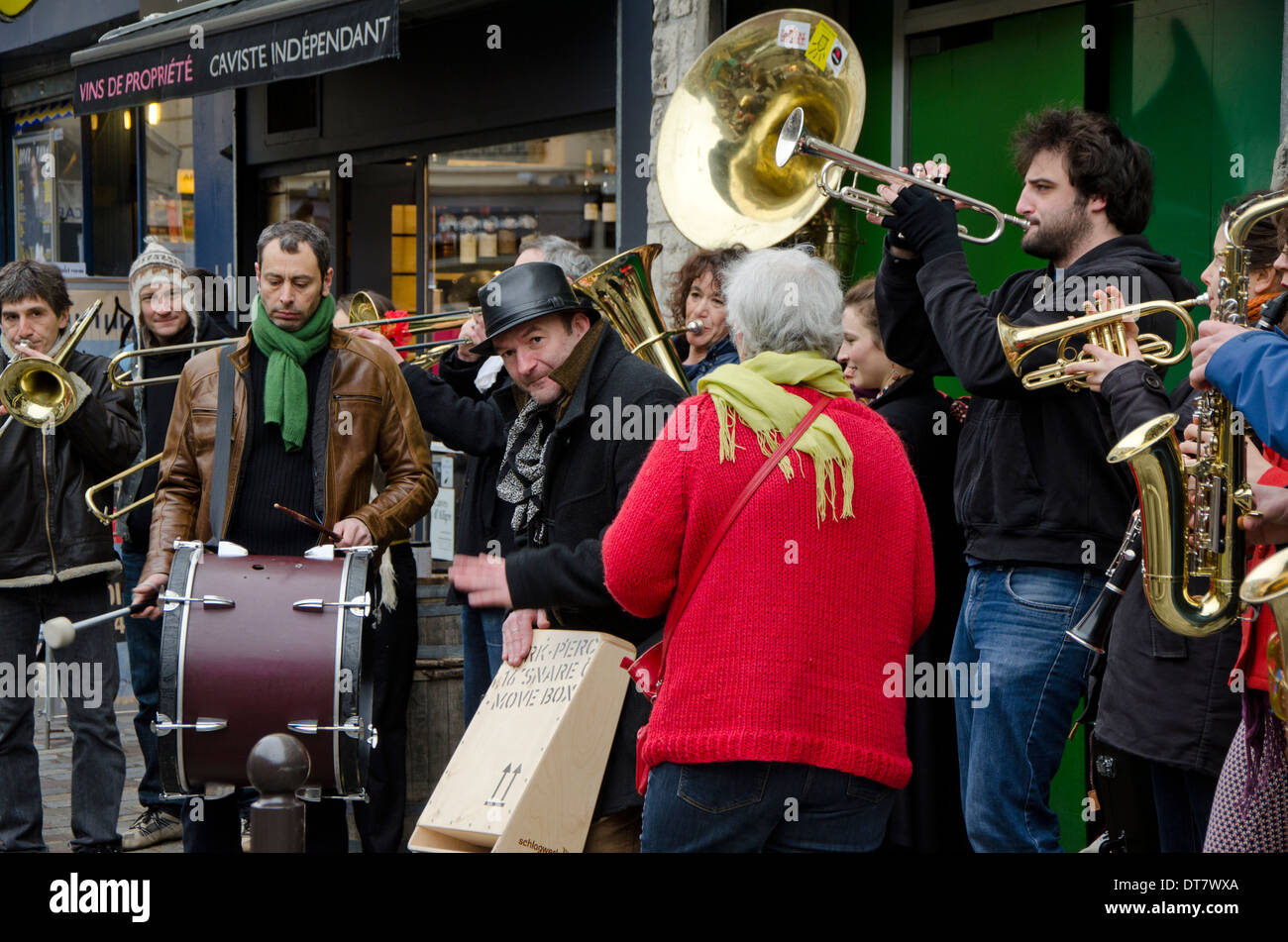 Street musicians giving a performance in a street in Paris, France. Stock Photo