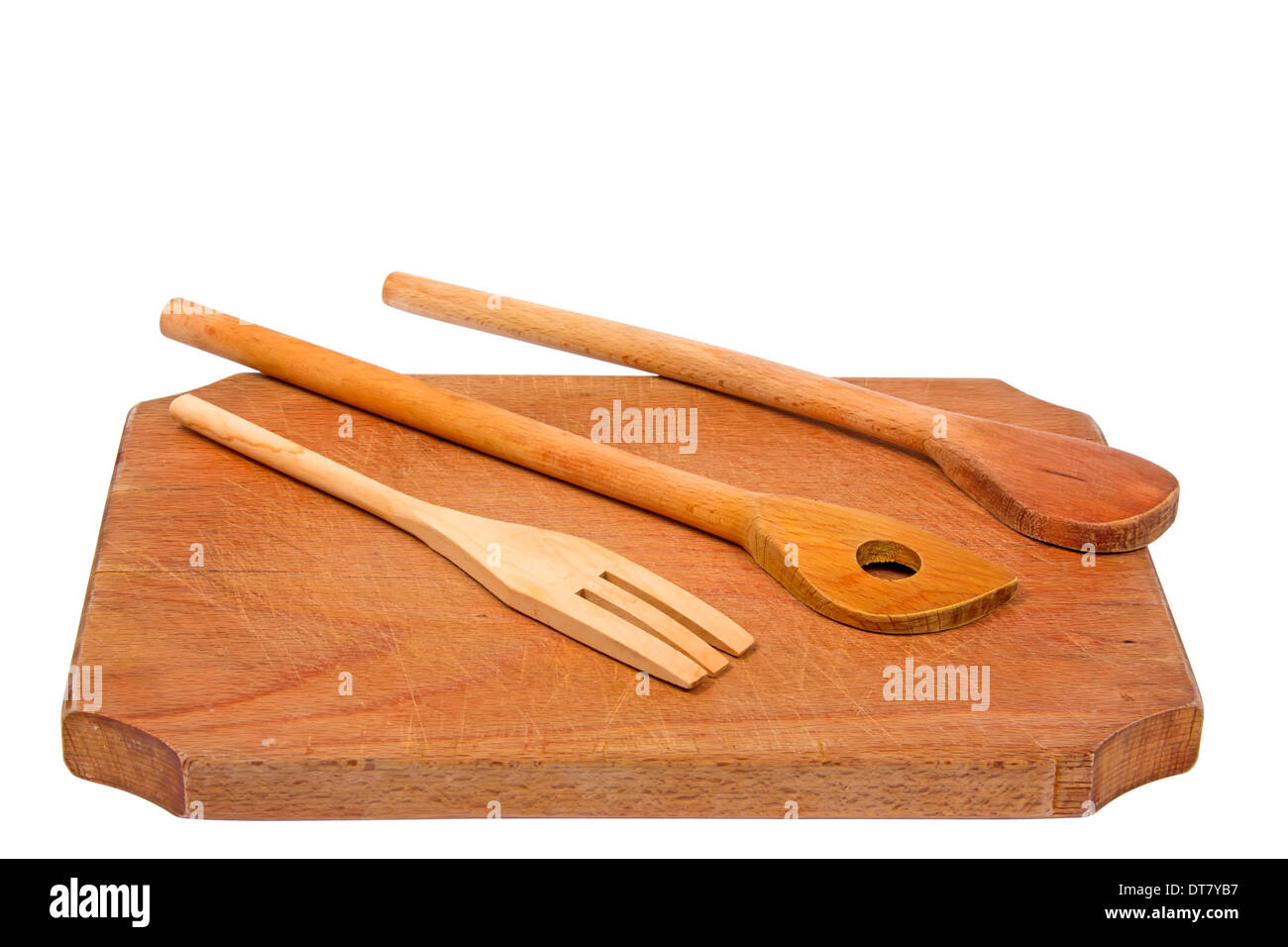 Wooden board and a few wooden spoons isolated on white Stock Photo