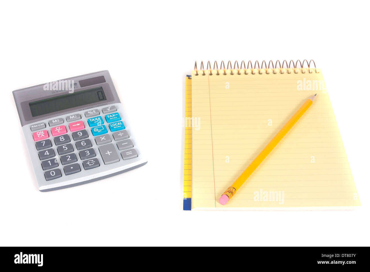 Single pencil on spiral notebook and one calculator isolated over white background Stock Photo