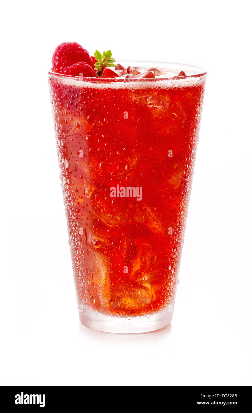 A cold glass of raspberry soda with ice cubes and condensation on white Stock Photo