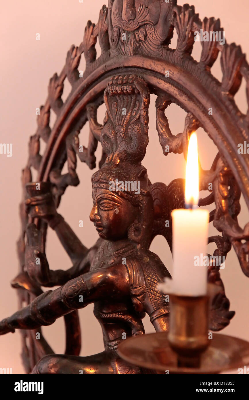 Statue of the goddess Shiva with candle as decoration in a yoga room
