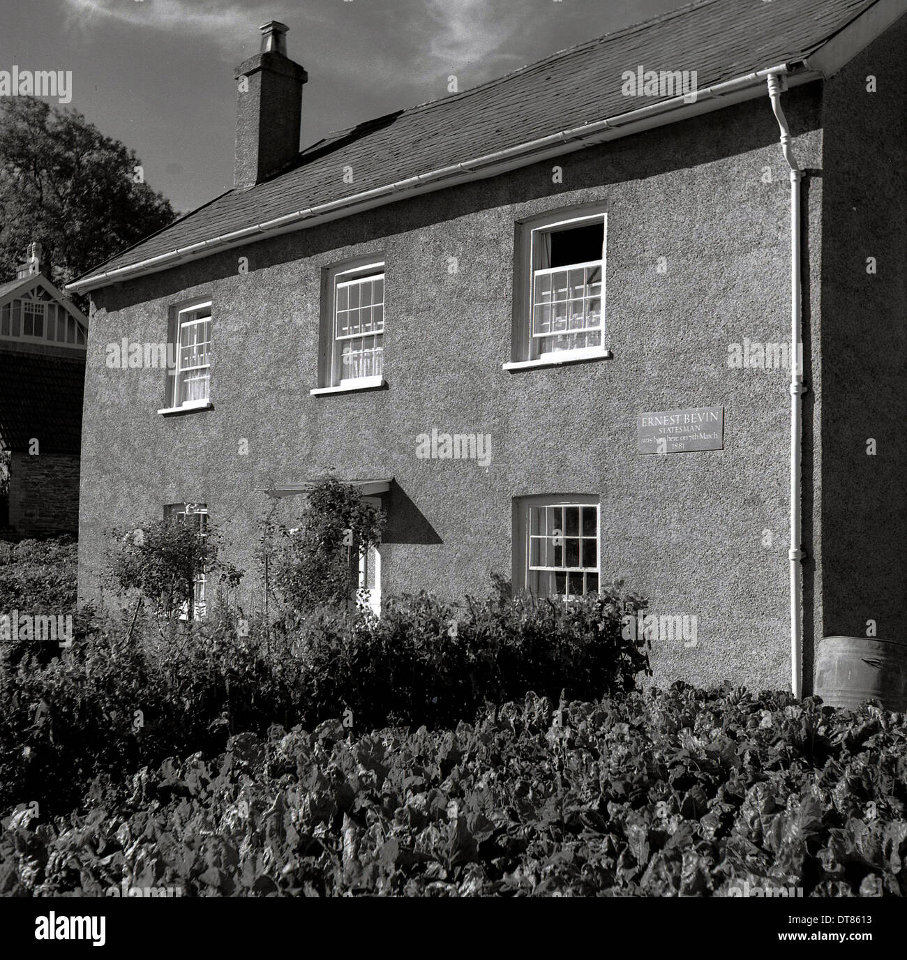 1960s historical, exterior view of the farmhouse where 1940s labour politican and statesman Ernest Bevan was born 7th March1881, originally two farm cottages, Edbrooke Rd, Winsmore, Somerset, England, UK. Plaque noting his birth can be seen on the right side of the property, Stock Photo