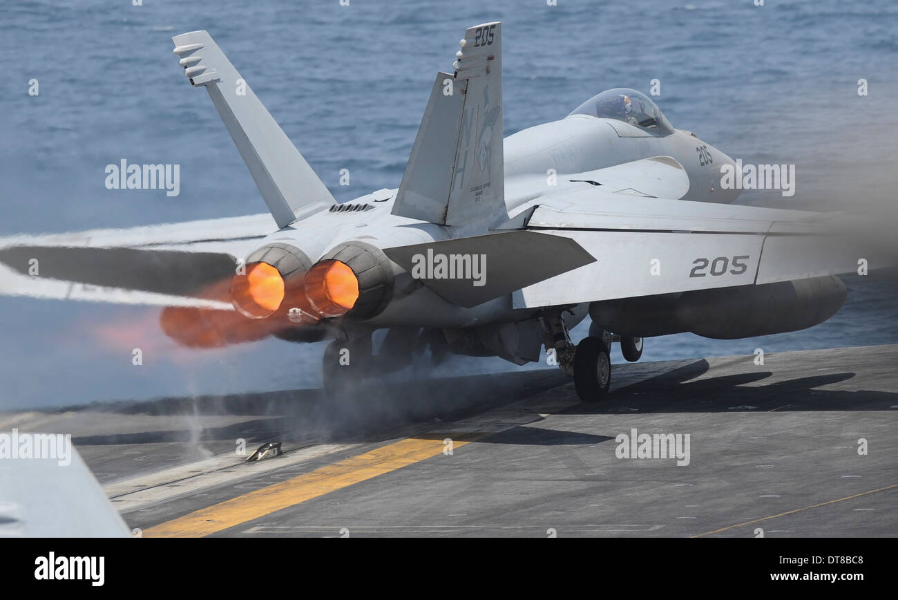 Arabian Gulf, July 4, 2013 - An F/A-18E Super Hornet launches from the aircraft carrier USS Nimitz. Stock Photo