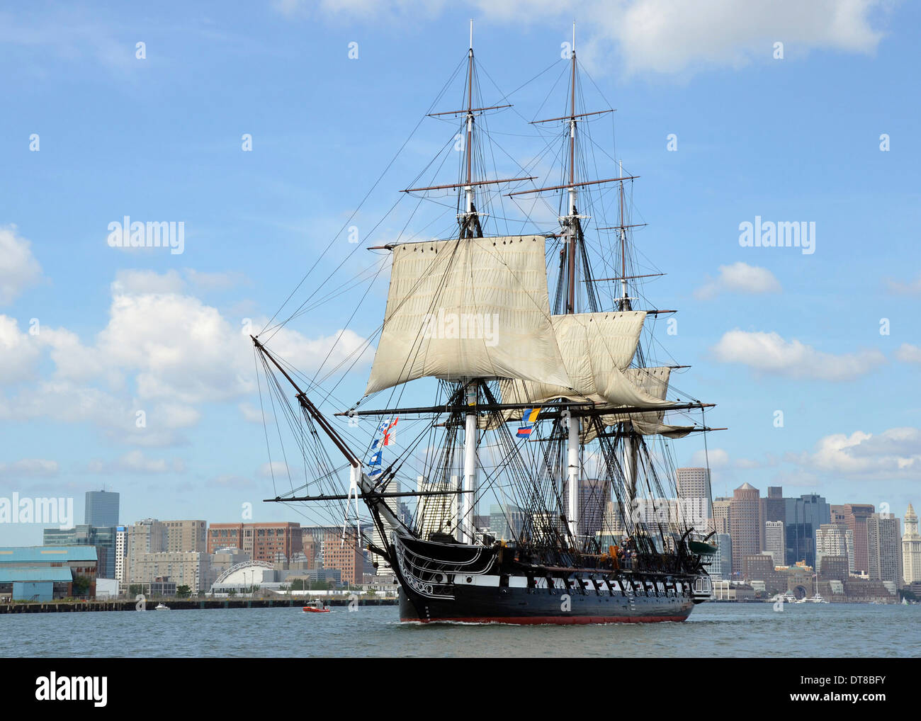 USS Constitution sets sail in Boston Harbor. Stock Photo