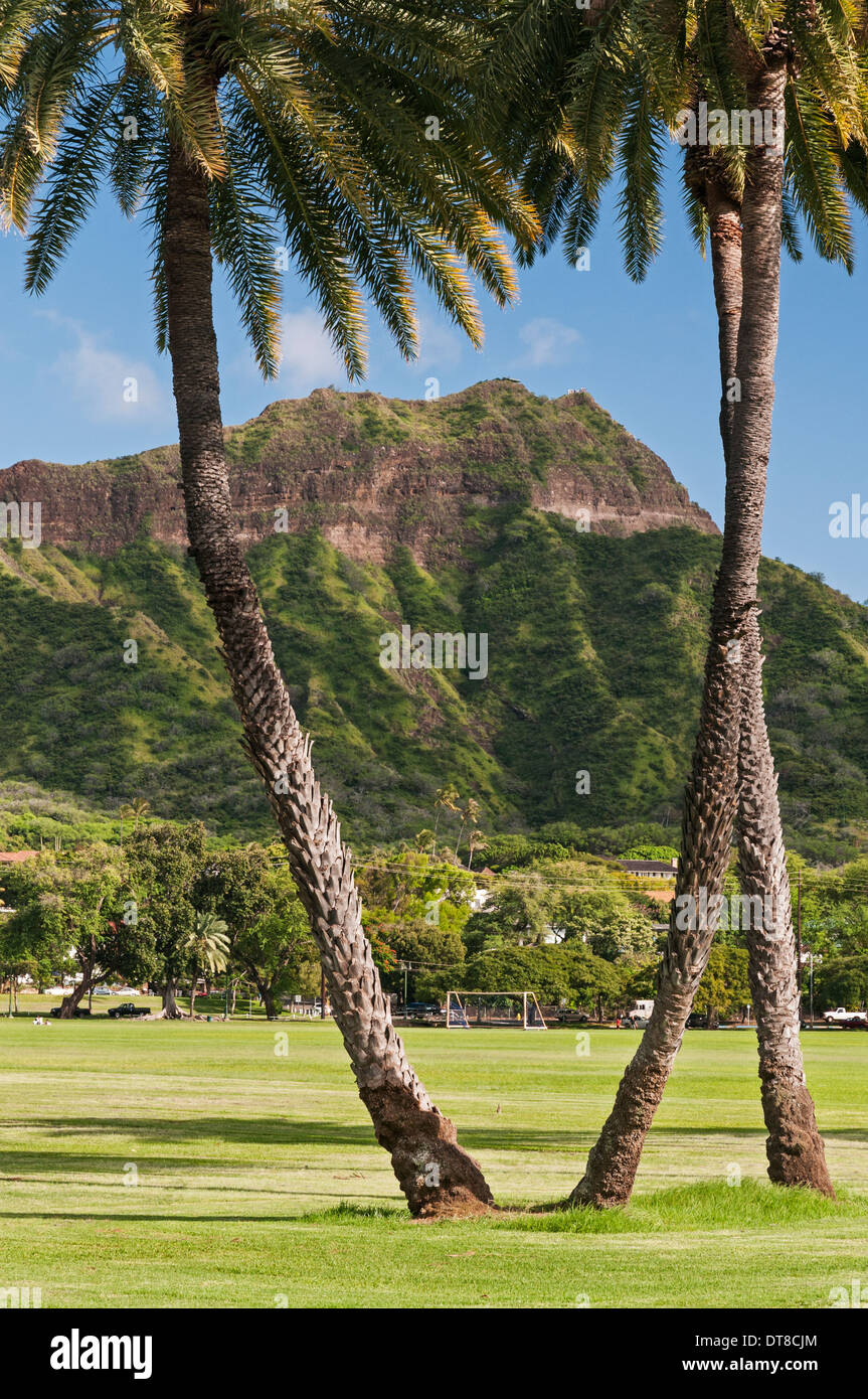 Diamond Head, a tuff cone volcanic crater is one of Hawaii's best known natural landmarks and Waikiki's backdrop. Stock Photo