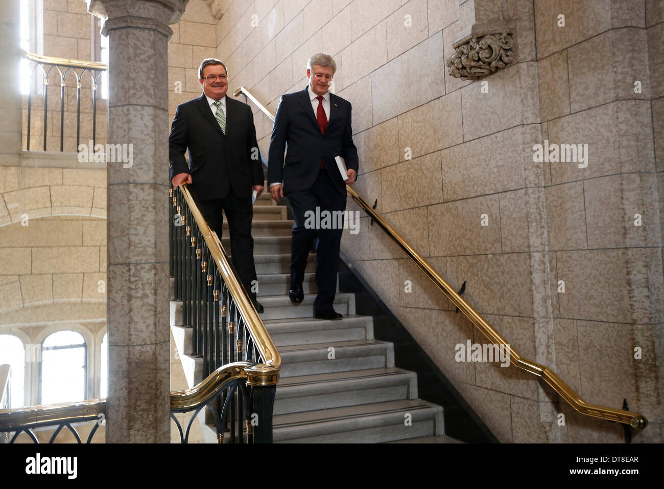 Ottawa, Canada. 11th Feb, 2014. Canada's Prime Minister Stephen Harper (R) and Finance Minister Jim Flaherty arrive to announce the new federal budget at Parliament Hill in Ottawa, Canada, Feb. 11, 2014. Jim Flaherty on Tuesday unveiled a federal budget projecting a surplus in 2015. © David Kawai/Xinhua/Alamy Live News Stock Photo
