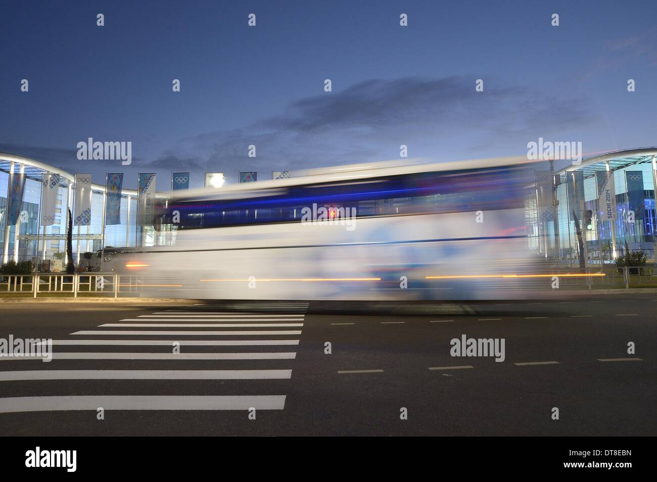 Sochi, Russia. 12th February 2014. A bus goes past the Sochi 2014 Winter Olympics Main Press Centre (MPC) and International Broadcast Centre (IBC) at dawn - Sochi - Russia - 12/02/2014 Credit:  Sport In Pictures/Alamy Live News Stock Photo