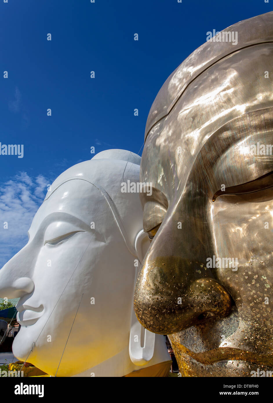 The architecture of golden and white buddha face the heart of buddhism Stock Photo