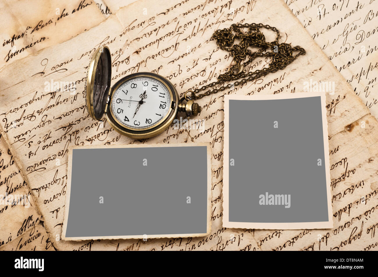 Letters with pictures and vintage pocket watch Stock Photo