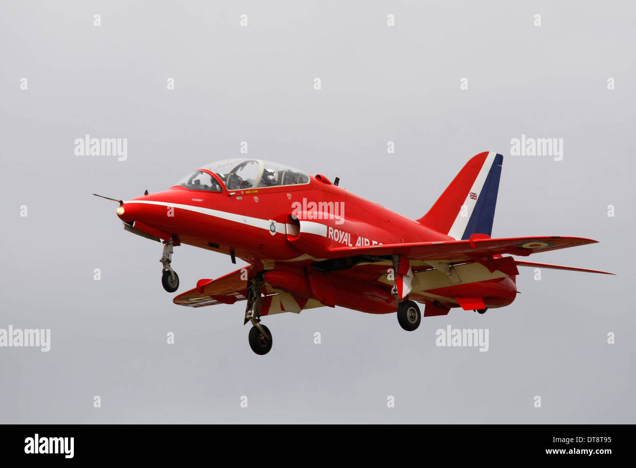 Red Arrow on final approach to Farnborough Air show runway following display. Slighly overcast conditions offering good detail. Stock Photo