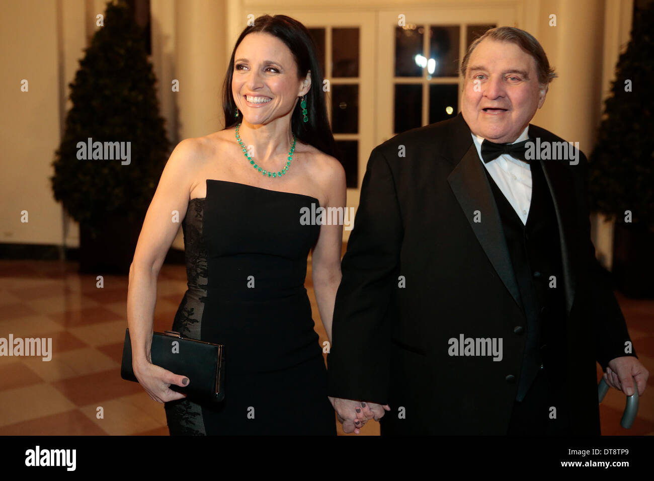 Washington DC, USA. 11th Feb, 2014. Actress Julia Louis-Dreyfus, left, and William Louis-Dreyfus arrive to a state dinner hosted by U.S. President Barack Obama and first lady Michelle Obama in honor of French President Francois Hollande at the White House in Washington, USA, 11 February 2014. Obama and Hollande said the U.S. and France are embarking on a new, elevated level of cooperation as they confront global security threats in Syria and Iran, deal with climate change and expand economic cooperation. Credit: Andrew Harrer / Pool via CNP/dpa/Alamy Live News Stock Photo