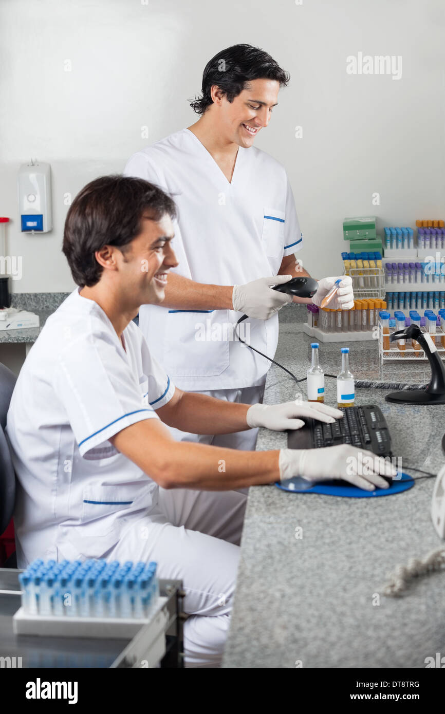 Technicians Scanning Sample With Barcode Reader Stock Photo - Alamy