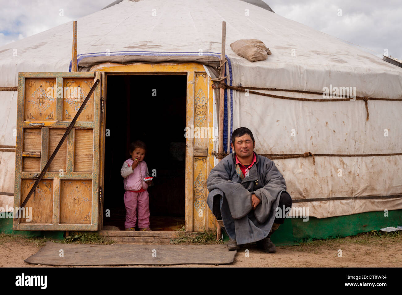 Mongolian nomad and his daughter outside their Ger Stock Photo - Alamy
