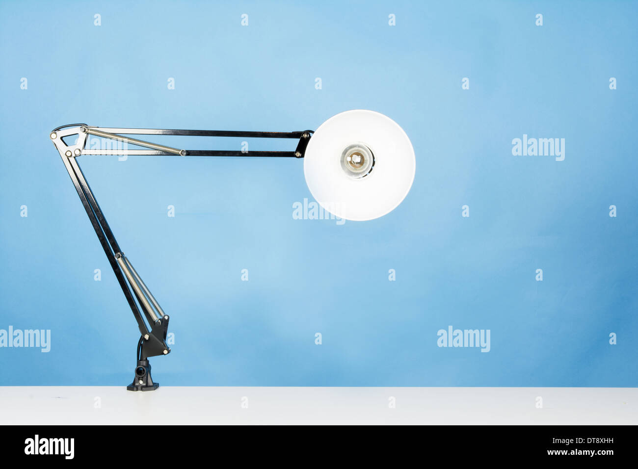 a table lamp on blue background Stock Photo