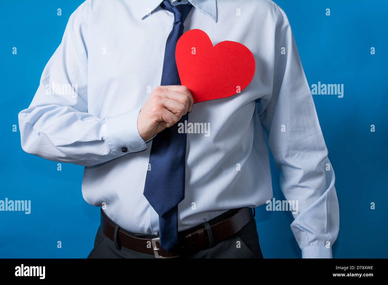 man shows a red heart in love Stock Photo