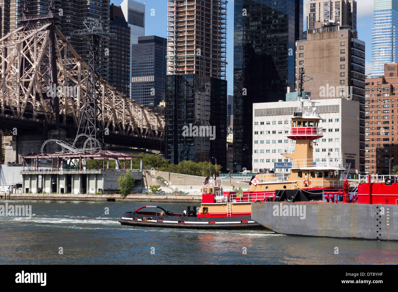 Barge and Tugboat,The Ed Koch Queensboro Bridge and East River, NYC Stock Photo