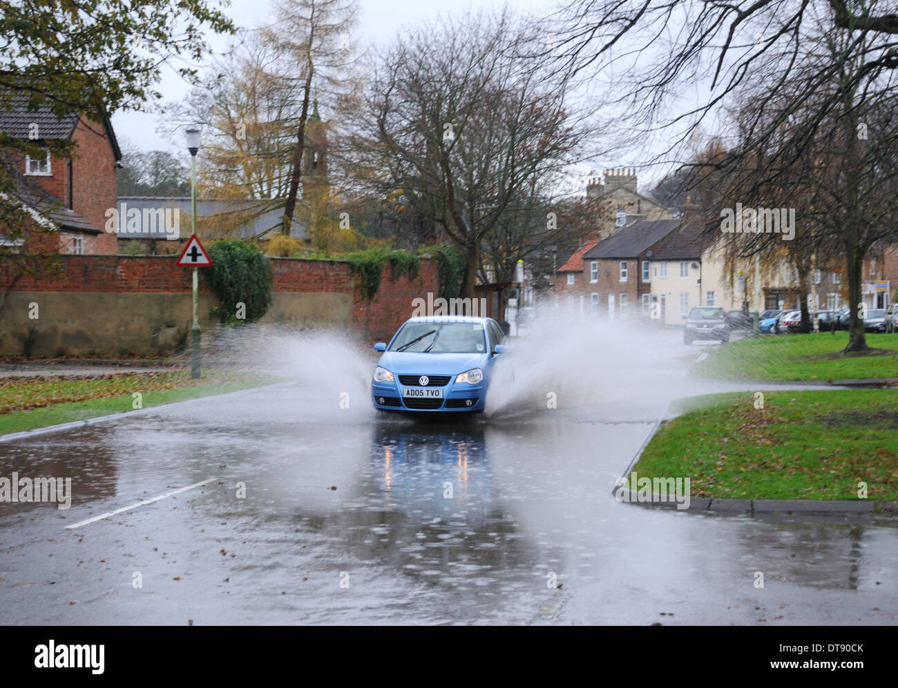 Local flooding on road after heavy rainfall Stock Photo
