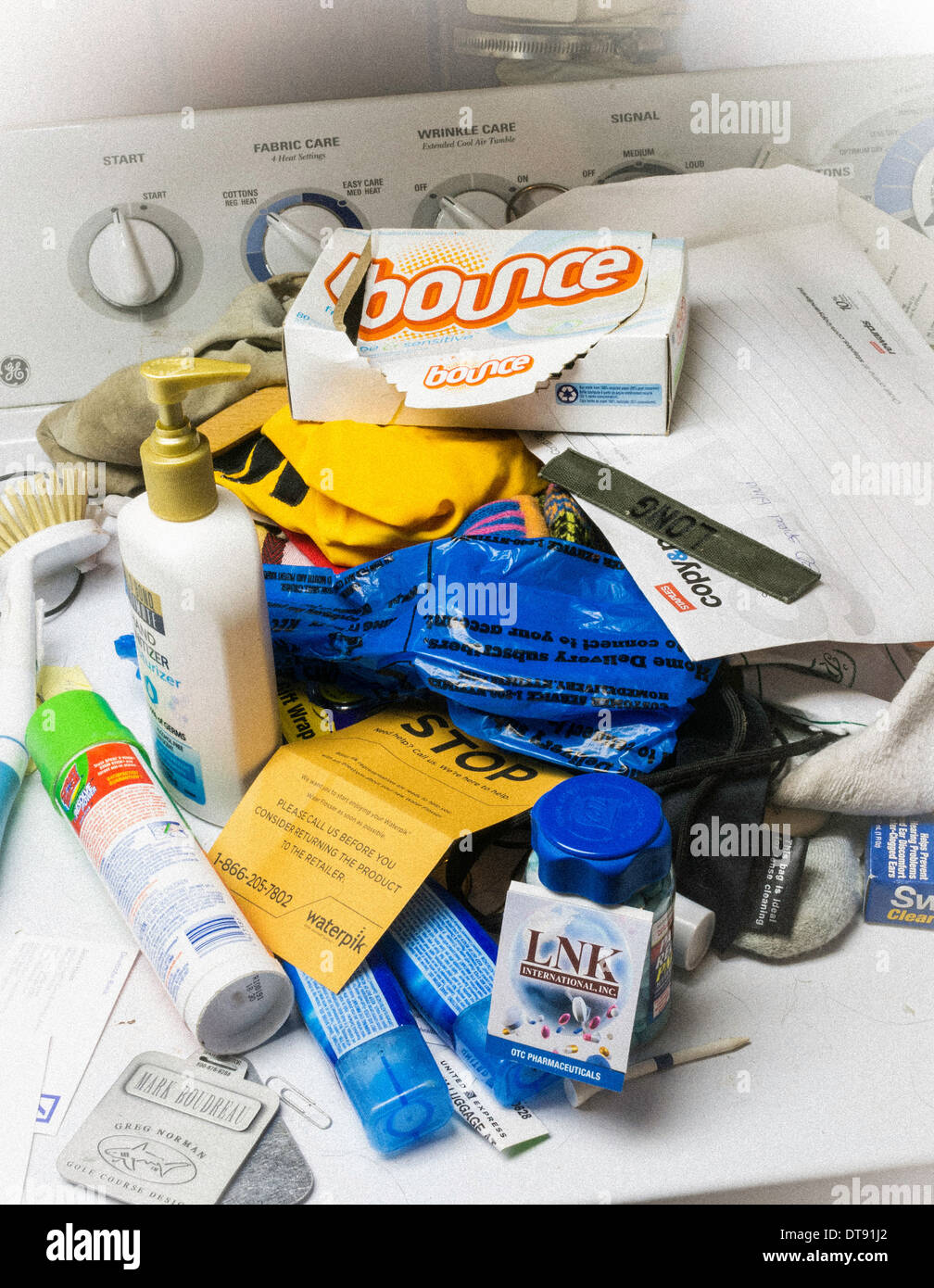 Household Items Clutter on Residential Washing Machine, USA Stock Photo