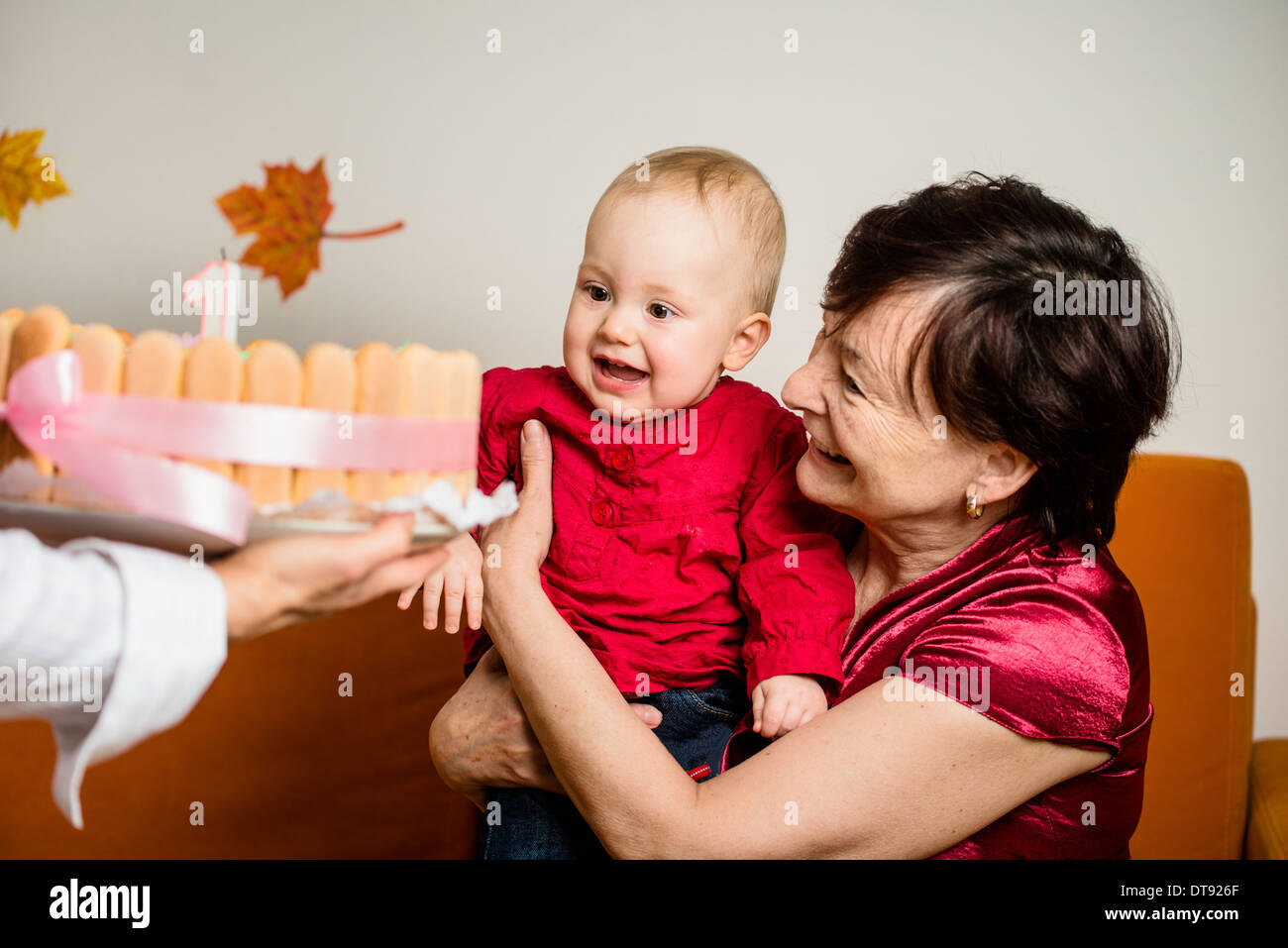 Grandmother with her baby grandchild celebrating first birthday Stock Photo